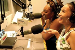 two female students on microphones