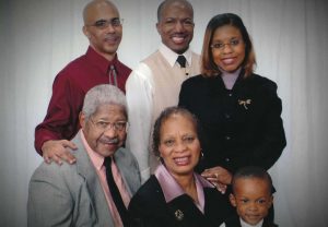 The family in 2006: (standing, left to right) Daniel McKenney, Vincent Black and Gilesa McKenney-Black; (seated, left to right) Martin McKenney, Nampeo Ross McKenney and their grandson Michael-Luther Black