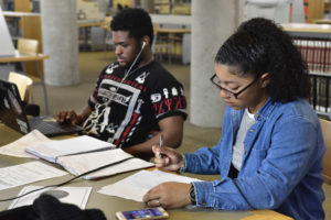 male and female students studying